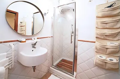 a bathroom with a sink and a shower at Nostromondo Apartments in Rome City Centre in Rome