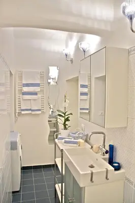 a bathroom with a sink and a mirror at Nostromondo Apartments in Rome City Centre in Rome