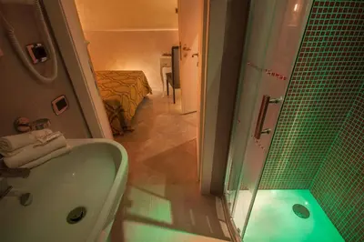 a bathroom with a shower and a tub and a sink at Quality in Rome in Rome