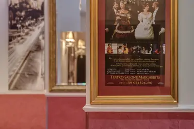 a framed picture on a wall with two mirrors at Quality in Rome in Rome