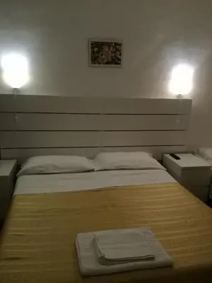 a bedroom with a bed with a towel on it at Testa Gioacchino B&B in Rome