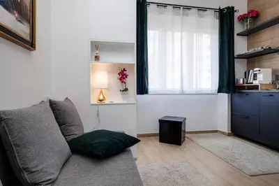 a living room with a couch and a window at Dreamsrome Lux in Rome