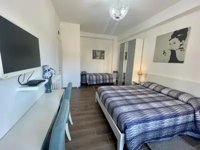 a hotel room with a bed and a television at Dreamsrome Lux in Rome