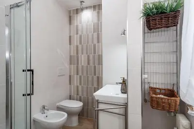 a small bathroom with a toilet and a sink at Dreamsrome Lux in Rome
