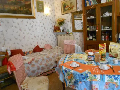 a dining room with a table and a table and chairs at Sidereus in Rome