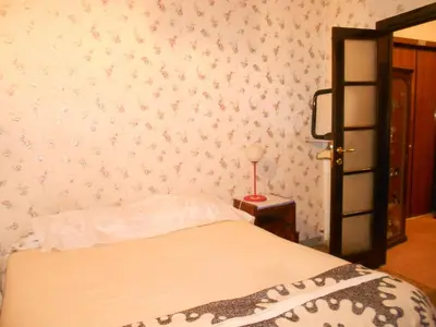 a bedroom with a bed and a wall with flowers at Sidereus in Rome