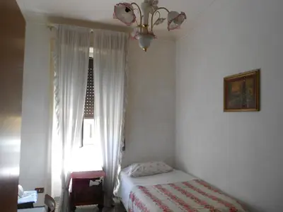 a small bedroom with a bed and a window at Sidereus in Rome