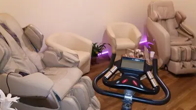 a room with four chairs and a table with a laptop on it at Freedom Love B&B in Rome