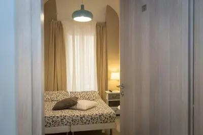 a small bedroom with a bed and a window at San Peter Angels in Rome