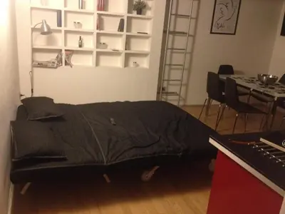 a bed in a room with a table and a keyboard at San Lorenzo 42 in Rome