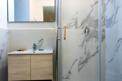 a bathroom with a shower and a sink at Navona Open Space Apartments in Rome