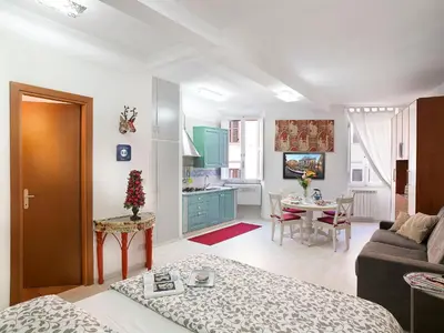 a living room with a couch and a table at Navona Open Space Apartments in Rome