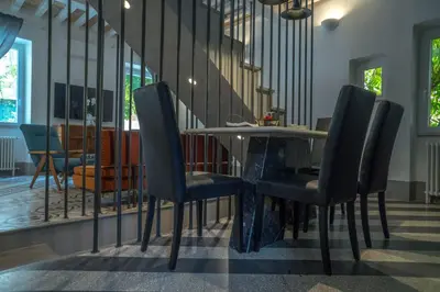 a dining room with a table and chairs at Navona Open Space Apartments in Rome