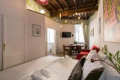 a living room with a couch and a table at Navona Open Space Apartments in Rome