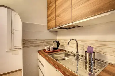 a kitchen with a sink and a counter top at Casa Monticelli in Rome