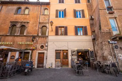 a building with a motorcycle parked in front of it at Casa Monticelli in Rome