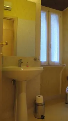 a bathroom with a sink and a mirror at B&B In Piazza in Rome