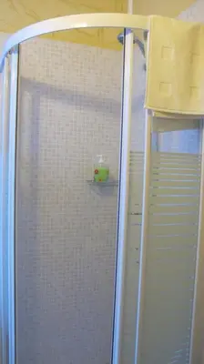 a shower with a glass door in a bathroom at B&B In Piazza in Rome