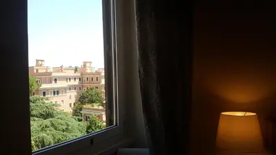 a window with a view of a building at Bed & Breakfast A Casa di Lia a Roma in Rome