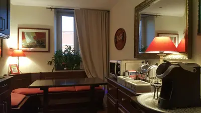 a room with a kitchen with a sink and a mirror at Bed & Breakfast A Casa di Lia a Roma in Rome