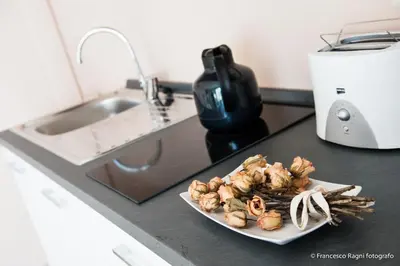a plate of food on a kitchen counter at B&B St. Peter's Suites in Rome