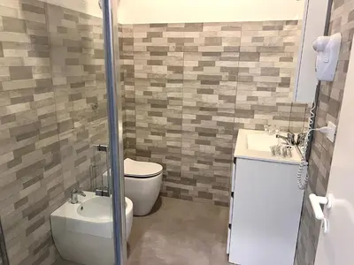 a bathroom with a toilet and a sink at A Quattro Passi Da in Rome
