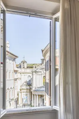 an open window with a view of a building at MyNavona in Rome