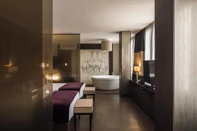 a hotel room with a bed and a bath tub at Rome Life Hotel in Rome