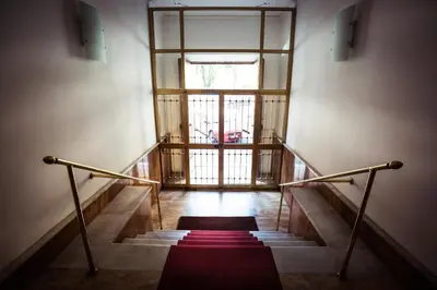 a stairway with a red carpet and a window at I Prati Di Roma in Rome