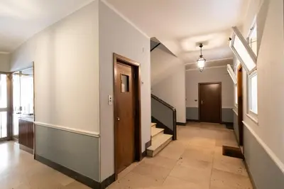 an empty hallway with stairs and a door at Fleming Suites by Hili in Rome