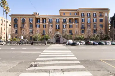 a building with a crosswalk in front of a street at Alex Place in Rome