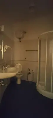 a bathroom with a sink and a toilet and a shower at In Rome in Rome