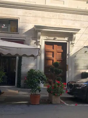 a car parked in front of a building with a door at Aurora 31 - Suite & Breakfast in Rome