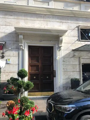 a car parked in front of a building with a door at Aurora 31 - Suite & Breakfast in Rome