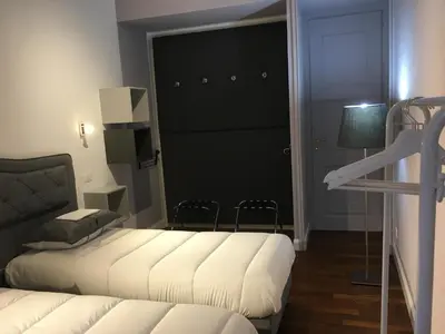 a room with two beds and a staircase in it at Luxury House Belle Arti Rome City Center in Rome