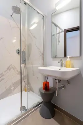 a bathroom with a sink and a shower at PgrHome Croce in Rome