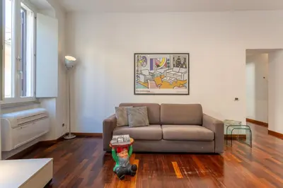 a living room with a couch and a table at PgrHome Croce in Rome