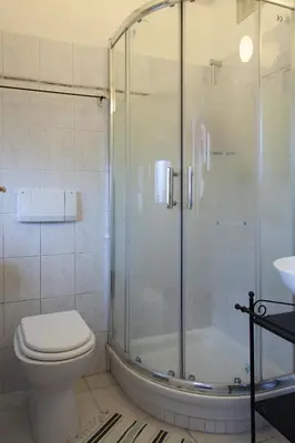 a bathroom with a shower and a toilet and a sink at Santa Croce in Rome