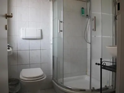 a bathroom with a shower and a toilet and a sink at Santa Croce in Rome