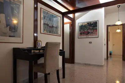 a office with a desk and a chair in a room at Santa Croce in Rome