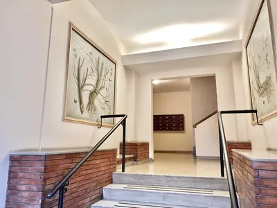 a hallway with stairs and a painting on the wall at Beside the Vatican in Rome