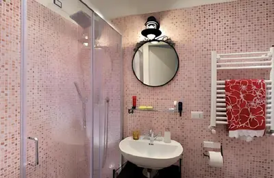 a bathroom with a sink and a shower and a mirror at Beside the Vatican in Rome