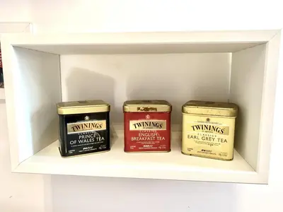 three candles sitting on a shelf in a drawer at Beside the Vatican in Rome