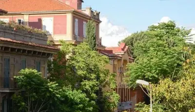 a group of buildings with trees in front of them at B&B Villa Musa in Rome