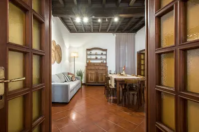a living room with a couch and a table at Trevi Fountain House Deluxe in Rome