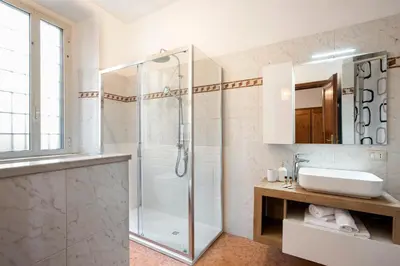 a bathroom with a shower and a sink at Trevi Fountain House Deluxe in Rome