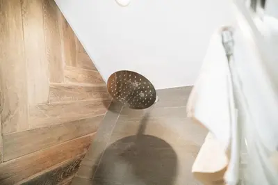 a shower head in front of a door at DownTown Boutique House - CA Domus Collection in Rome