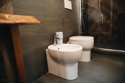 a bathroom with a toilet and a bidet at DownTown Boutique House - CA Domus Collection in Rome