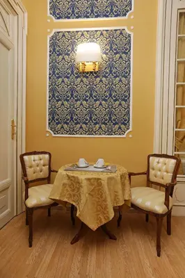 a dining room with a table and two chairs at DG Prestige Room in Rome