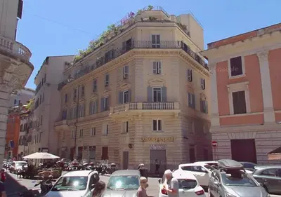 a kitchen and living room with a table and a couch at Al Centro Storico Roma Suite in Rome